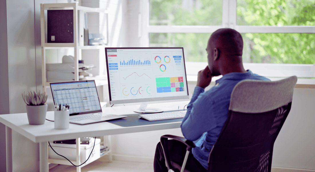 Small business owner checking online marketing success with Gulf Designworks SEO services.