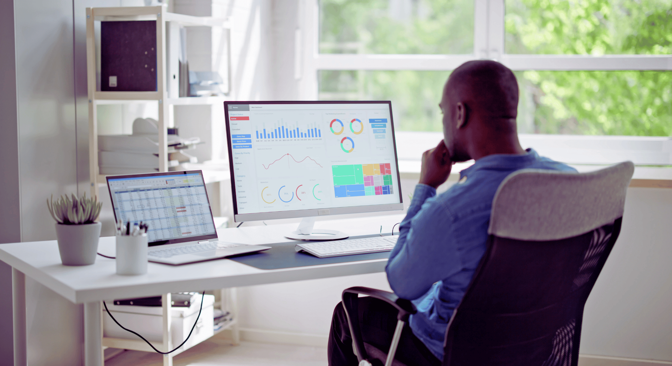 Small business owner checking online marketing success with Gulf Designworks SEO services.